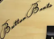 ButtonBass Acoustic Guitar logo